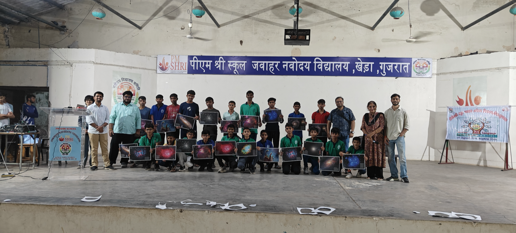 Students at PM Shri School Jawahar Navodaya Vidyalaya holding astronomy posters